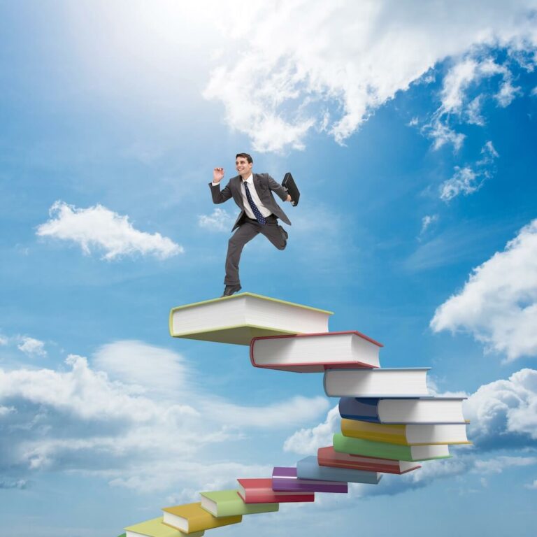 Image of a business man running up a book staircase representing Agile Leadership